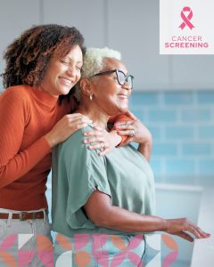 Two women smile and embrace, promoting the importance of cancer screening with warmth and connection.